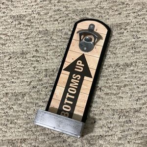 Wall mounted bottle opener